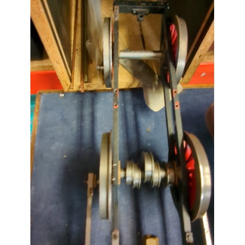 A group of model steam locomotive engineering components, including a ...