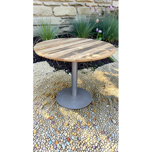Circular plank-top table, on a grey-painted metal pedestal column with broad circular foot.