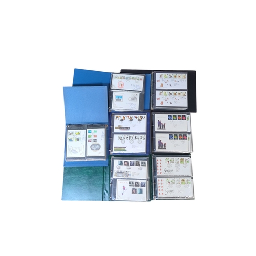 Lot 113: A collection of 7 x folders of British Royal Mail first-day covers, including commemorative issues depicting architecture, railways, waterways and gardens, with dated postmarks, housed in ring binders.