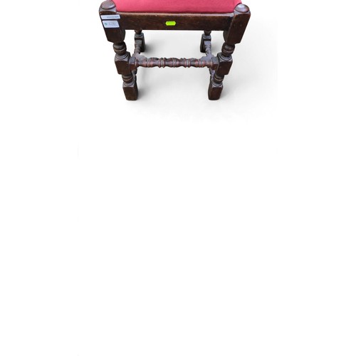 Rectangular upholstered stool with a red fabric seat, dark-stained ...
