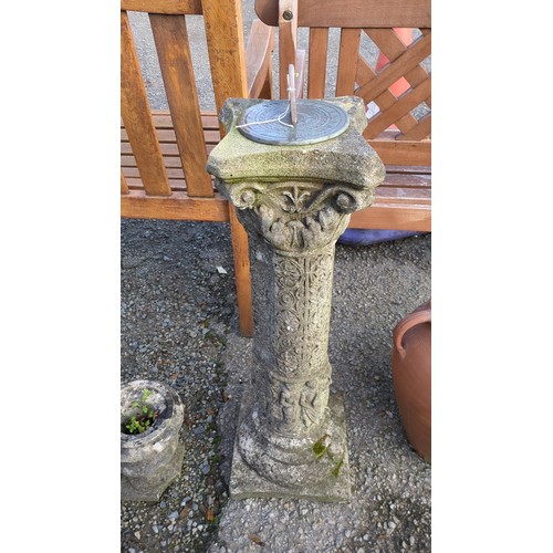 Cast-stone garden sundial with a circular metal dial inscribed “Sunny ...