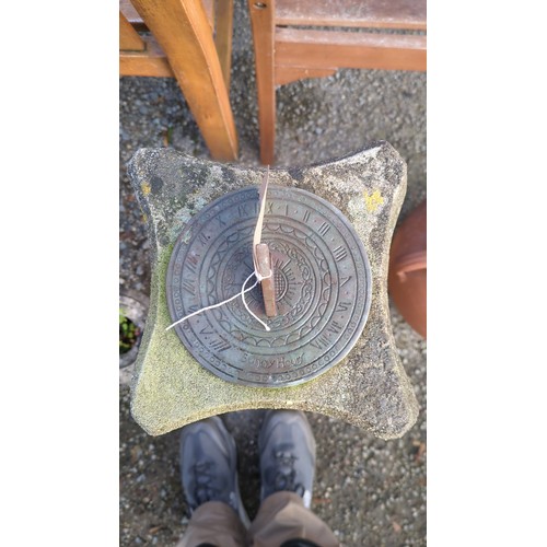 Cast-stone garden sundial with a circular metal dial inscribed “Sunny ...