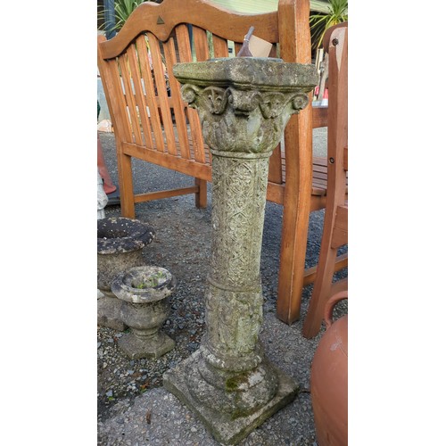 Cast-stone garden sundial with a circular metal dial inscribed “Sunny ...