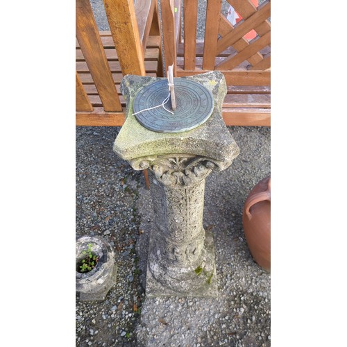 Cast-stone garden sundial with a circular metal dial inscribed “Sunny ...