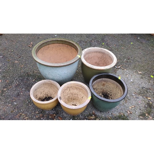 Five glazed ceramic garden planters of varying sizes, comprising a ...