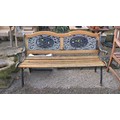 Cast-iron and timber garden bench with a slatted seat and shaped crest ...