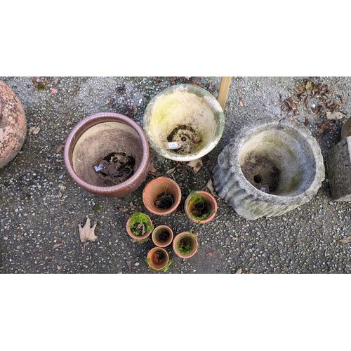 A group of garden planters comprising brown- and blue-glazed ceramic ...