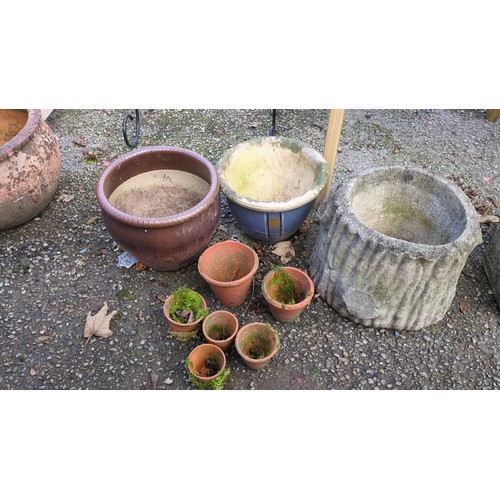 A group of garden planters comprising brown- and blue-glazed ceramic ...