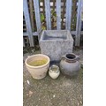Four garden planters comprising a large square cast-stone planter, a ...