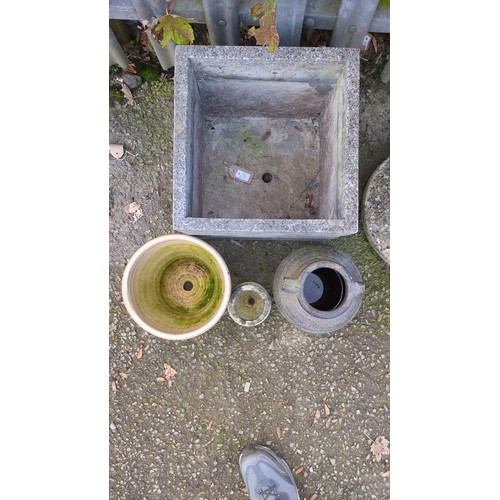 Four garden planters comprising a large square cast-stone planter, a ...