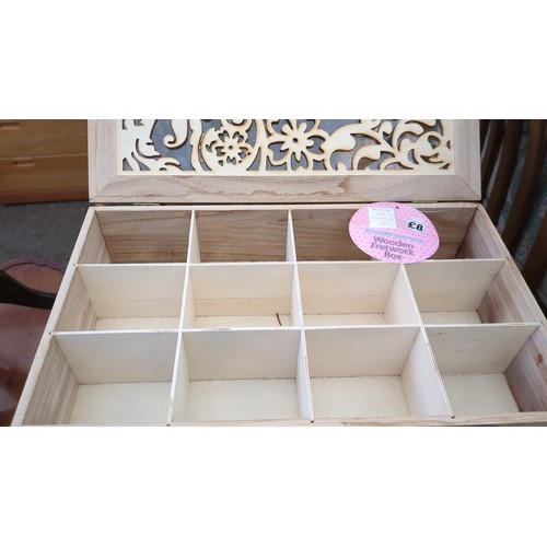 A group of four rectangular wooden storage boxes with hinged ...