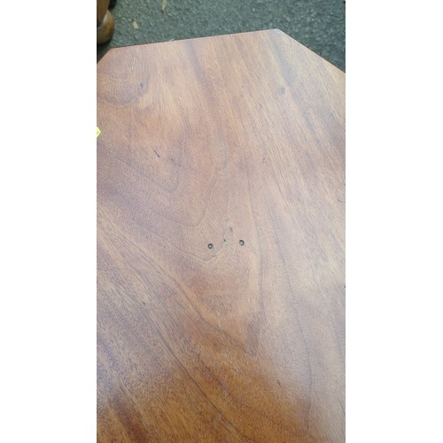 Octagonal occasional table with a single square pedestal and four swept ...
