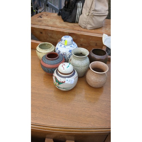 A group of ceramic jars and vases, including blue-and-white floral and ...
