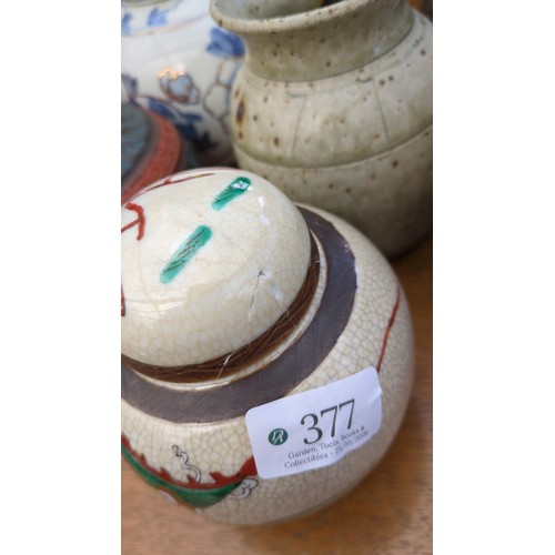 A group of ceramic jars and vases, including blue-and-white floral and ...