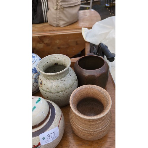 A group of ceramic jars and vases, including blue-and-white floral and ...