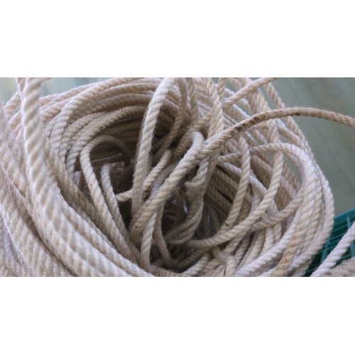 A large coil of cream-coloured, three-strand twisted rope.