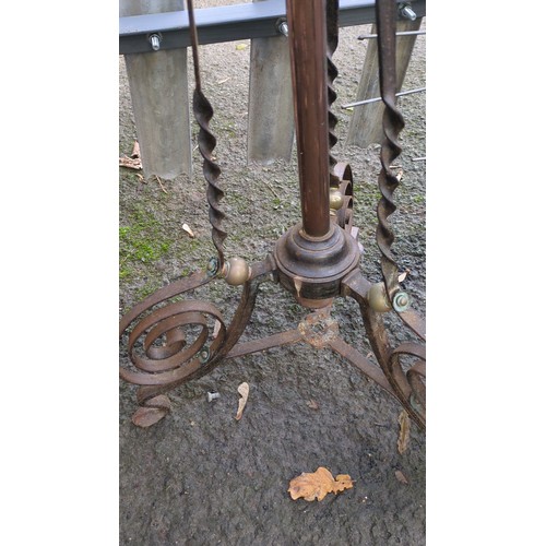 Adjustable brass and wrought-iron jardinière stand.