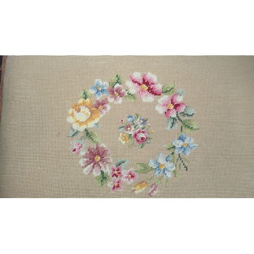 Rectangular carved wood footstool with a padded floral needlepoint seat ...