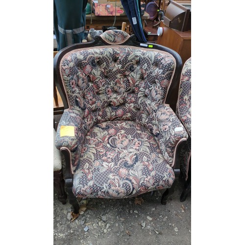 Upholstered armchair with a dark-stained timber frame, scroll-carved ...
