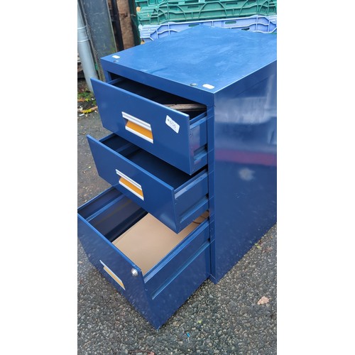 Blue-painted steel filing cabinet with three drawers, recessed label ...