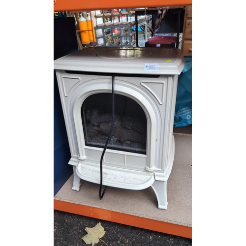 Lot 657: Gazco Huntingdon 20 electric stove, model 615-581, in ivory enamel, with an arched glazed front, simulated log fire, fluted side panels and integral footplate; rated 2,000W. RRP ~£1500