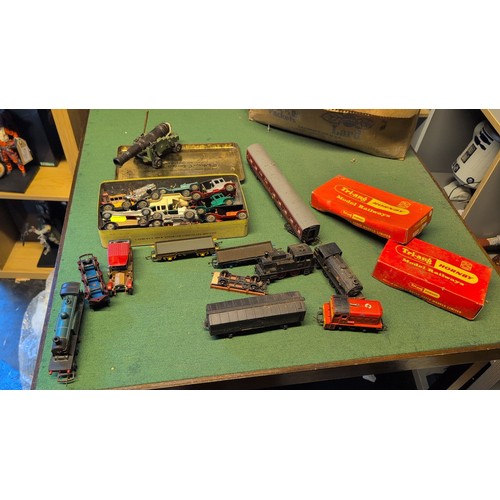 A collection of model railway locomotives, coaches, wagons and track ...