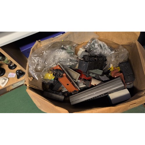A collection of model railway locomotives, coaches, wagons and track ...