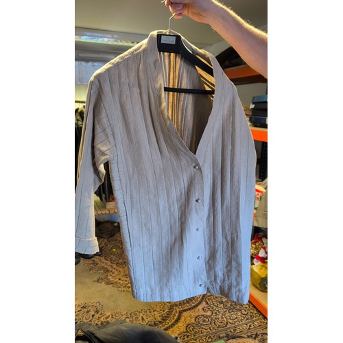 A group of garments comprising a blue paisley-print button-front shirt ...