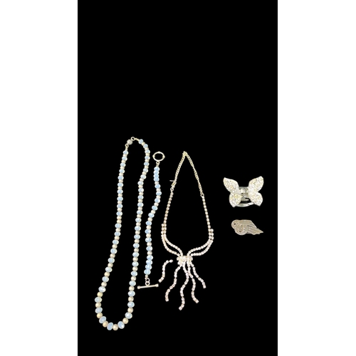 A group of costume jewellery and accessories comprising a necklace of ...