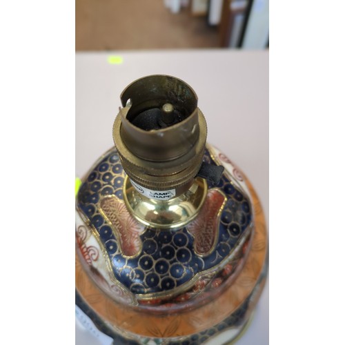 Chinese ceramic table lamp of baluster form, decorated in raised gilt ...