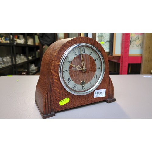 Smiths Enfield mantel clock in an arched oak case, with Roman-numeral ...