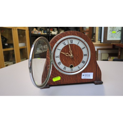 Smiths Enfield mantel clock in an arched oak case, with Roman-numeral ...