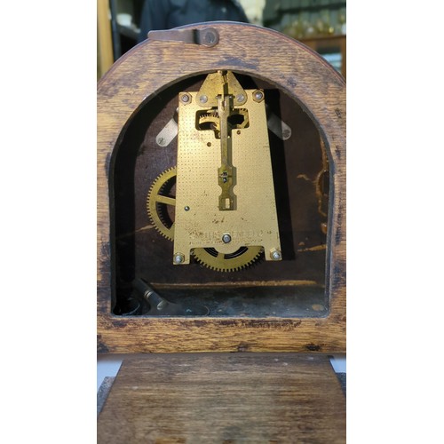 Smiths Enfield mantel clock in an arched oak case, with Roman-numeral ...