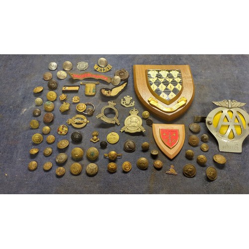 A collection of British and Commonwealth military buttons, cap badges ...