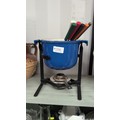 Blue enamelled metal fondue pot with twin lug handles and a cream ...