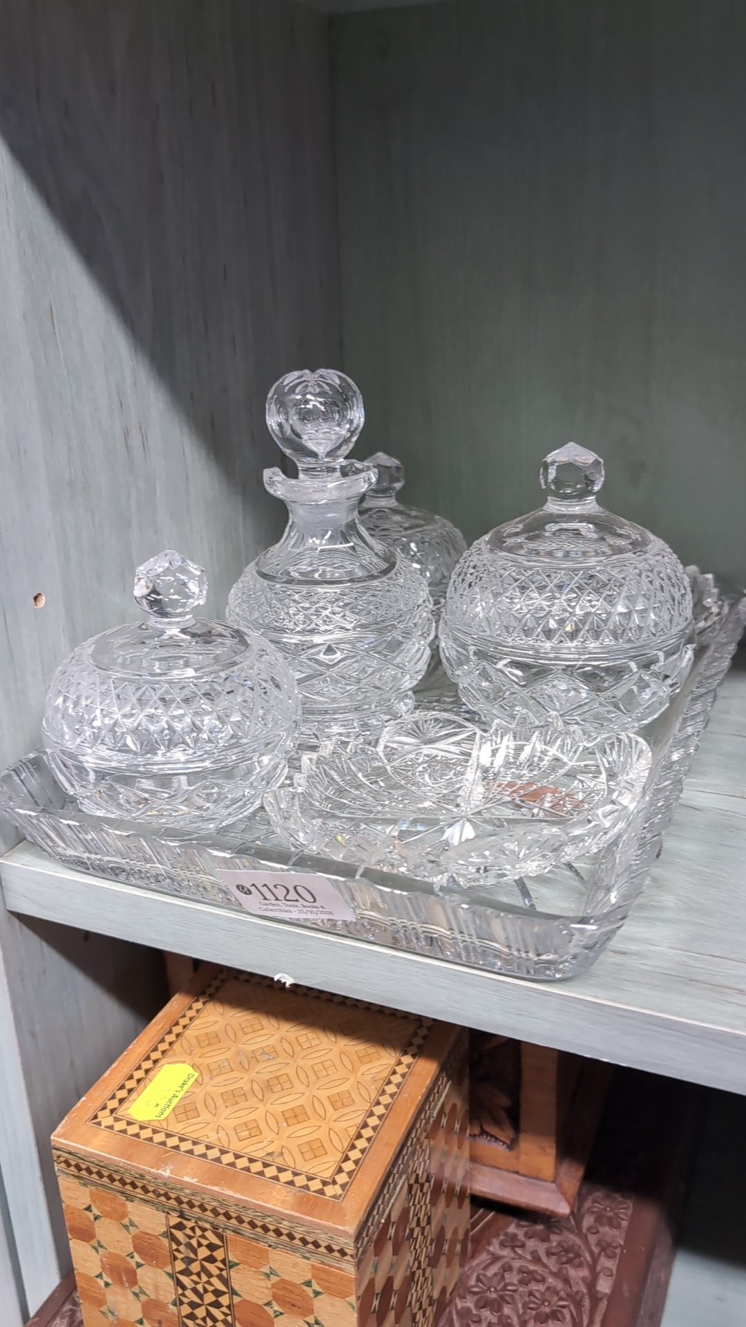 Cut-glass dressing-table set comprising a stoppered bottle, covered ...