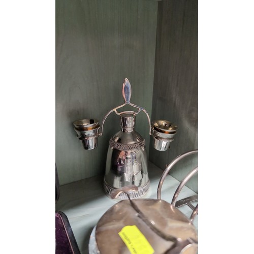A group of silver-plated tablewares comprising a bell-form centrepiece ...