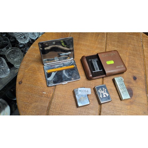 A group of smoking accessories comprising an Emu Brand metal cigarette ...