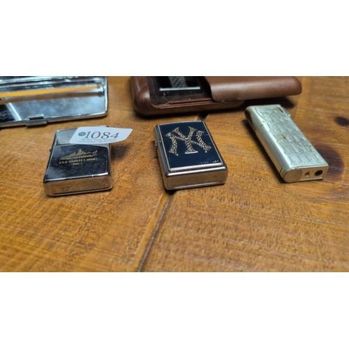 A group of smoking accessories comprising an Emu Brand metal cigarette ...