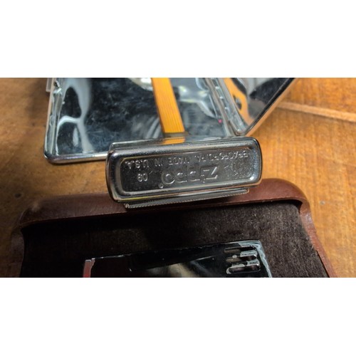 A group of smoking accessories comprising an Emu Brand metal cigarette ...