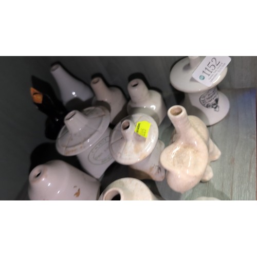 A collection of glazed ceramic pie funnels of various forms, including ...