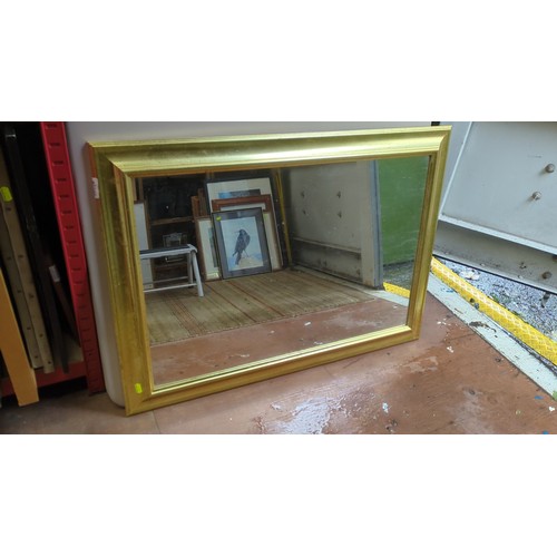 Rectangular wall mirror with a broad gilt-finish frame, coved moulding ...
