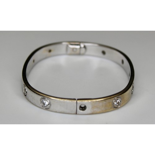 274 - DIAMOND SET TV SHAPE BANGLE WITH SCREW FITTINGS 9CT WHITE GOLD BIRMINGHAM 2007 -' RRP £3800