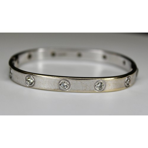 274 - DIAMOND SET TV SHAPE BANGLE WITH SCREW FITTINGS 9CT WHITE GOLD BIRMINGHAM 2007 -' RRP £3800