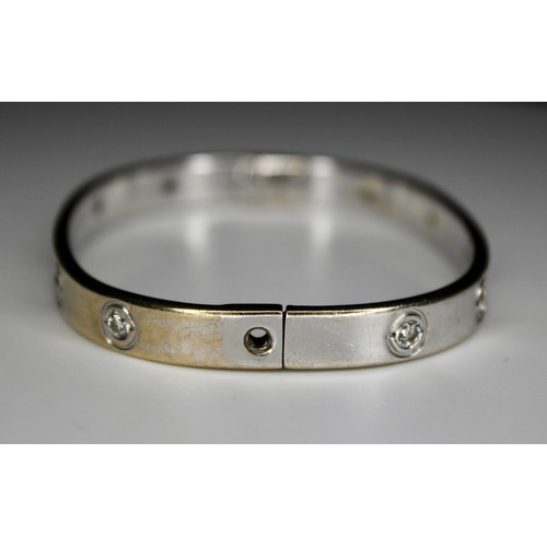 274 - DIAMOND SET TV SHAPE BANGLE WITH SCREW FITTINGS 9CT WHITE GOLD BIRMINGHAM 2007 -' RRP £3800