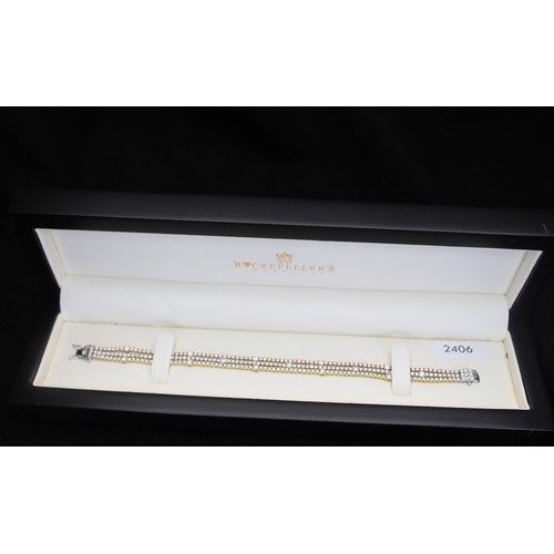 281 - ROUND BRILLIANT CUT DIAMOND TRIPLE ROW TENNIS STYLE BRACELET ESTIMATED TOTAL 6.17 CARATS 18CT YELLOW... 