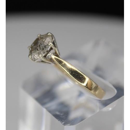 270 - 9CT GOLD DIAMOND SOLITAIRE RING -HEAVILY FLAWED