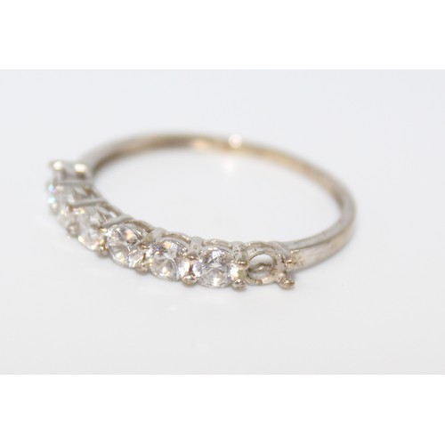 123 - 9CT (375) WHITE GOLD ETERNITY RING WITH 6 X WHITE STONES (NOT DIAMOND) (9298)