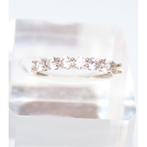 123 - 9CT (375) WHITE GOLD ETERNITY RING WITH 6 X WHITE STONES (NOT DIAMOND) (9298)