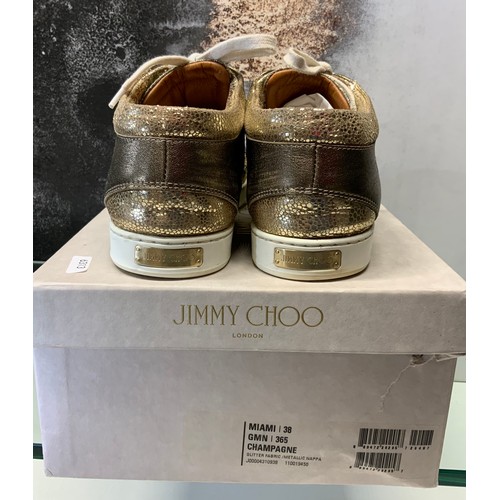 141 - JIMMY CHOO MIAMI CHAMPAGNE TRAINERS (GOLD)- IN BOX SIZE 38 - COST NEW £187 (P23039123 RR/16)